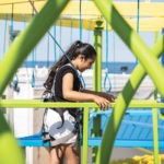 A female visitor enjoys Adventure Lookout Ropes Course at Jenkinson's Boardwalk