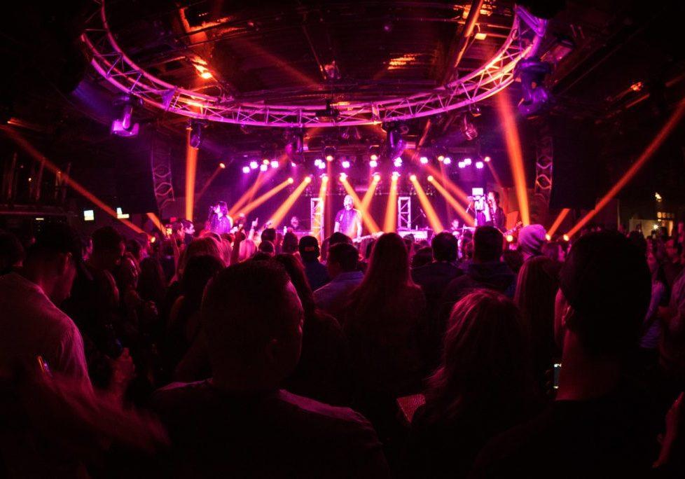 A music performance on the Jenk's Club stage with people in the crowd.